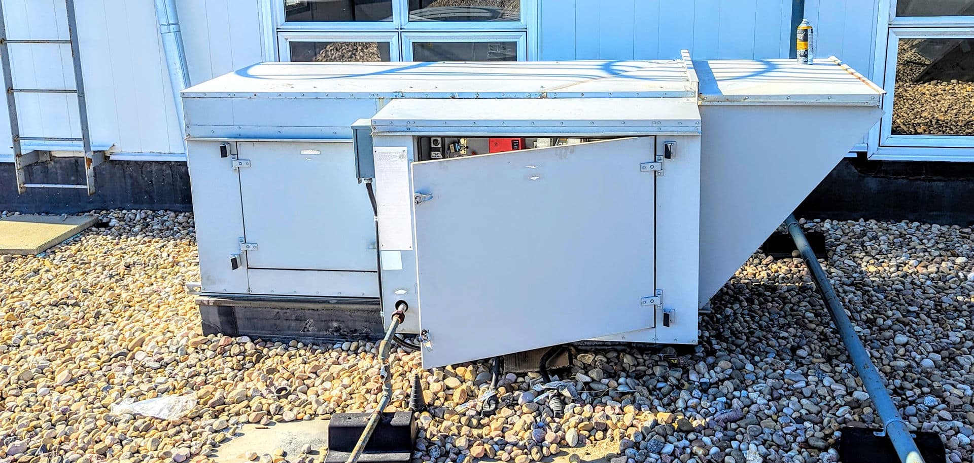 Commercial rooftop HVAC unit with its service panel open